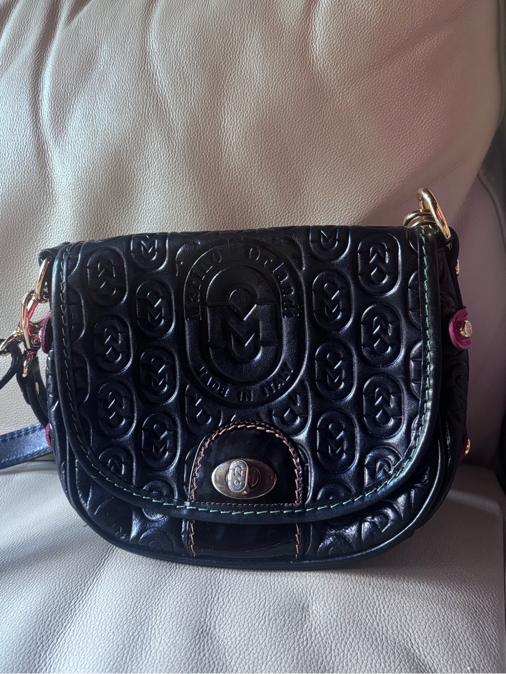 Designer Marion Orlandi Crossbody Bag - Leather with gold clasp hardware.
